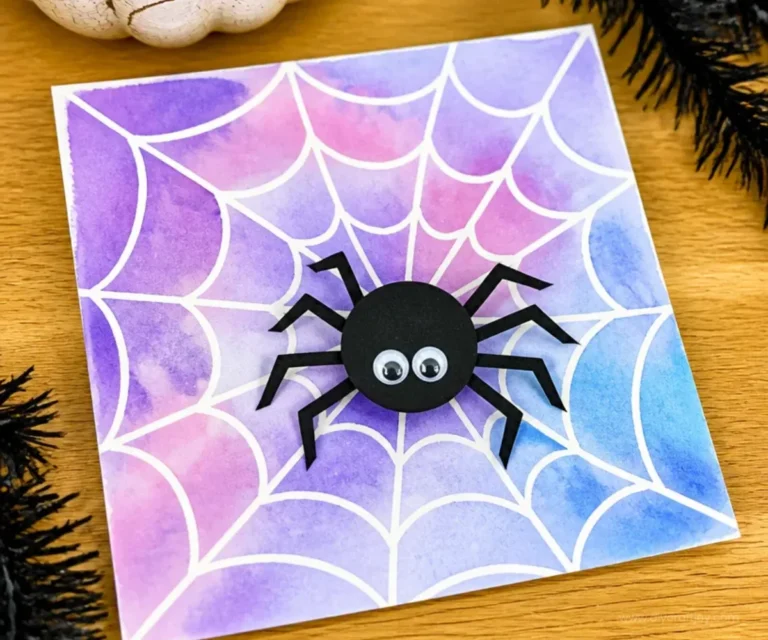 Kids creating watercolor Halloween crafts with pumpkins and ghosts.